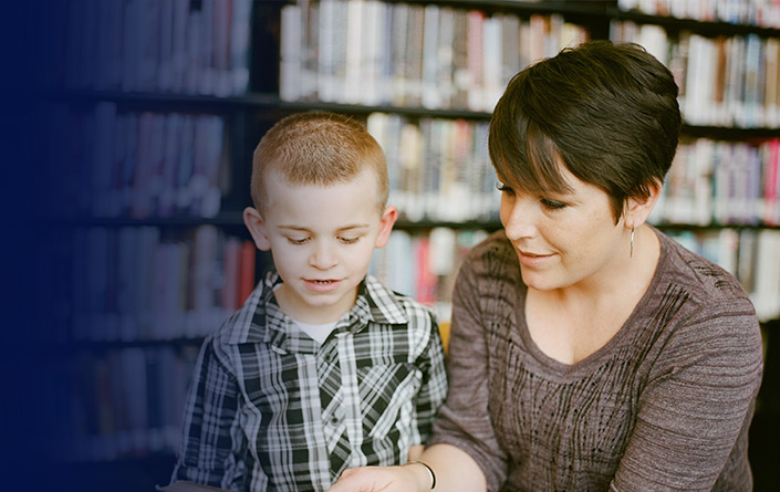 Woman reading to child