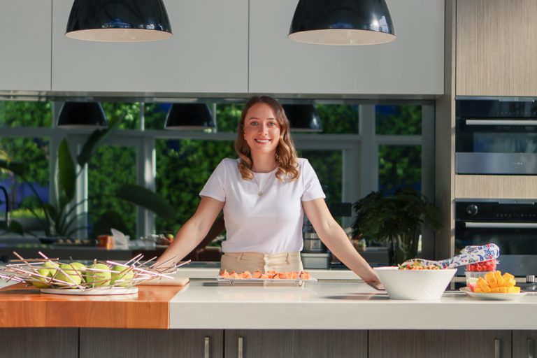 Kelsey Hutton standing in kitchen