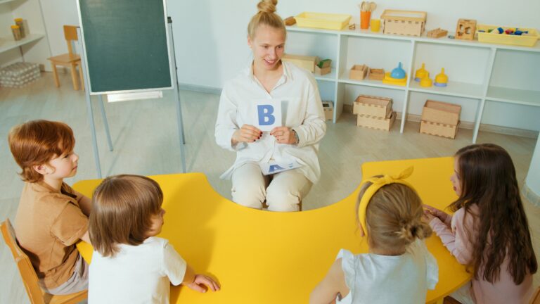 teacher in classroom teaching children