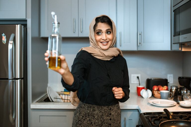 Nutritionists holding up a bottle of oil