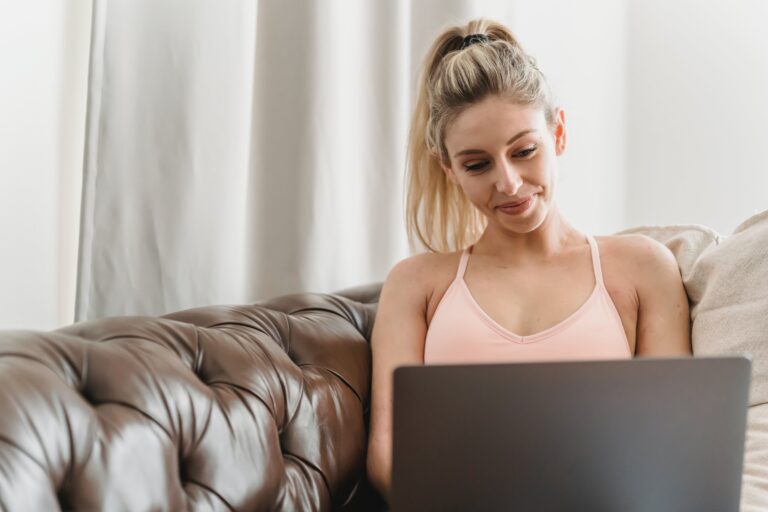 student sitting behind laptop